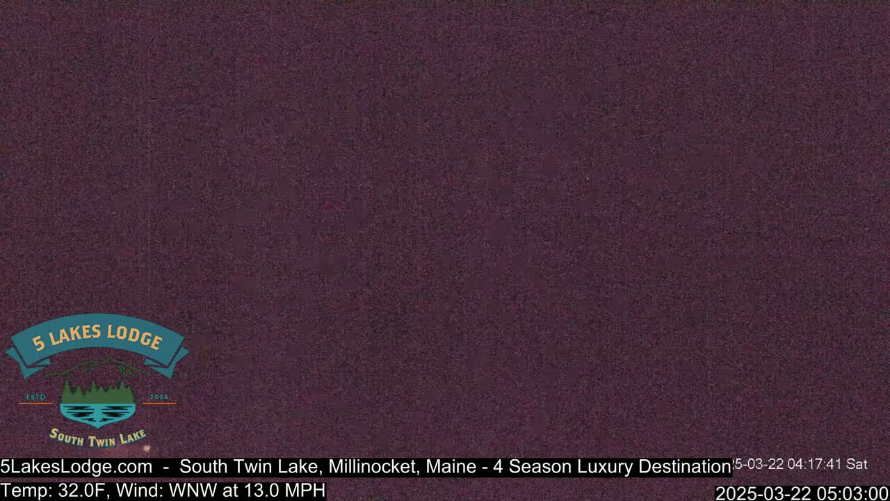 A dark purple, grainy image shows an overcast sky.
