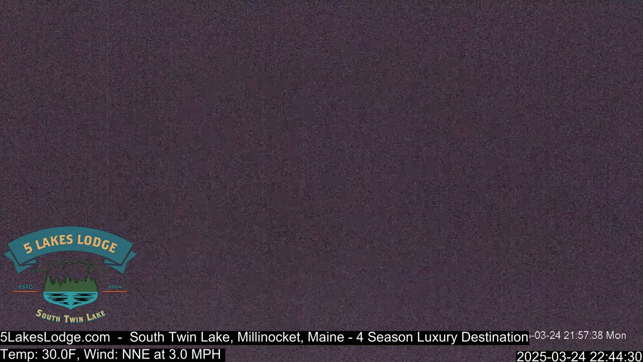 A dark purple screen displays a logo for a lodge.