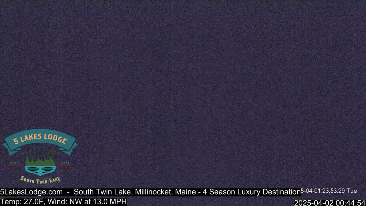 A dark purplish-blue screen shows a nighttime outdoor scene with a temperature of 27 degrees Fahrenheit and a northwest wind at 13 miles per hour.