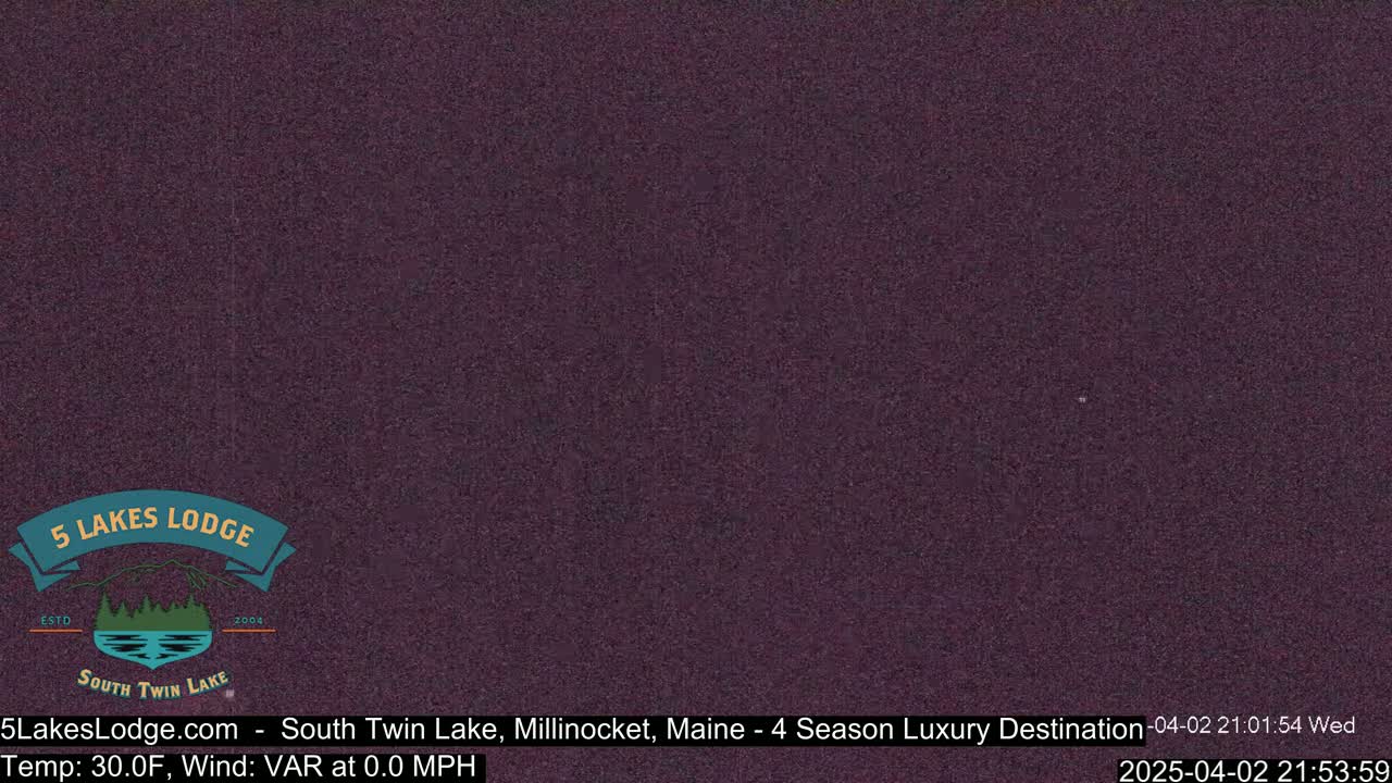 A dark purple screen displays a nighttime view with no discernible objects or features.