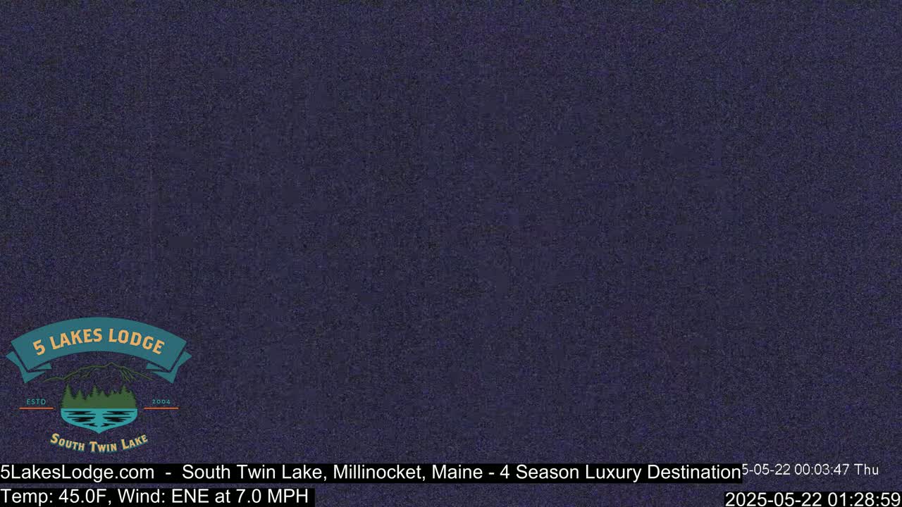 A dark, grainy image shows a solid dark-blue background.