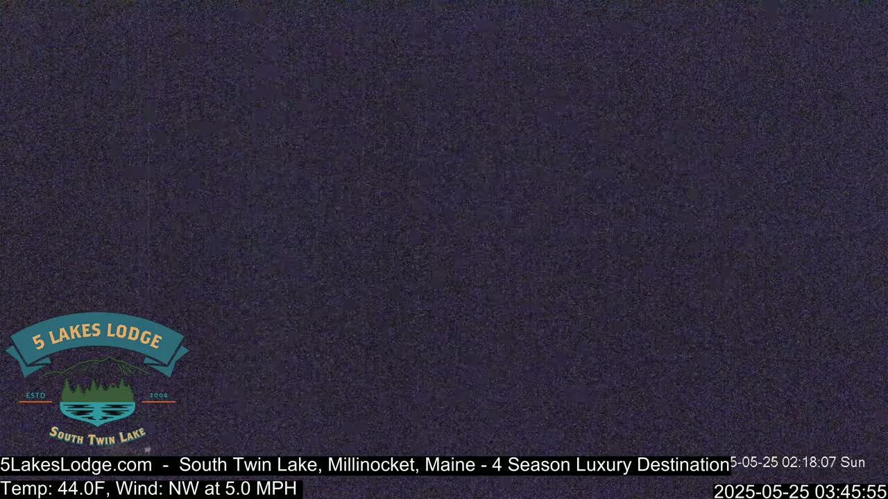 A dark, grainy image shows a night scene with a northwest wind blowing at 5.0 mph and a temperature of 44 degrees Fahrenheit.