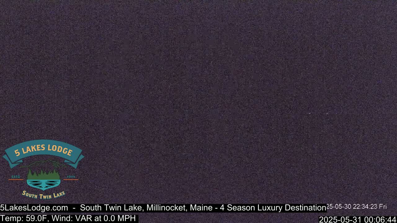 A dark, uniformly colored nighttime image shows a mostly clear sky.