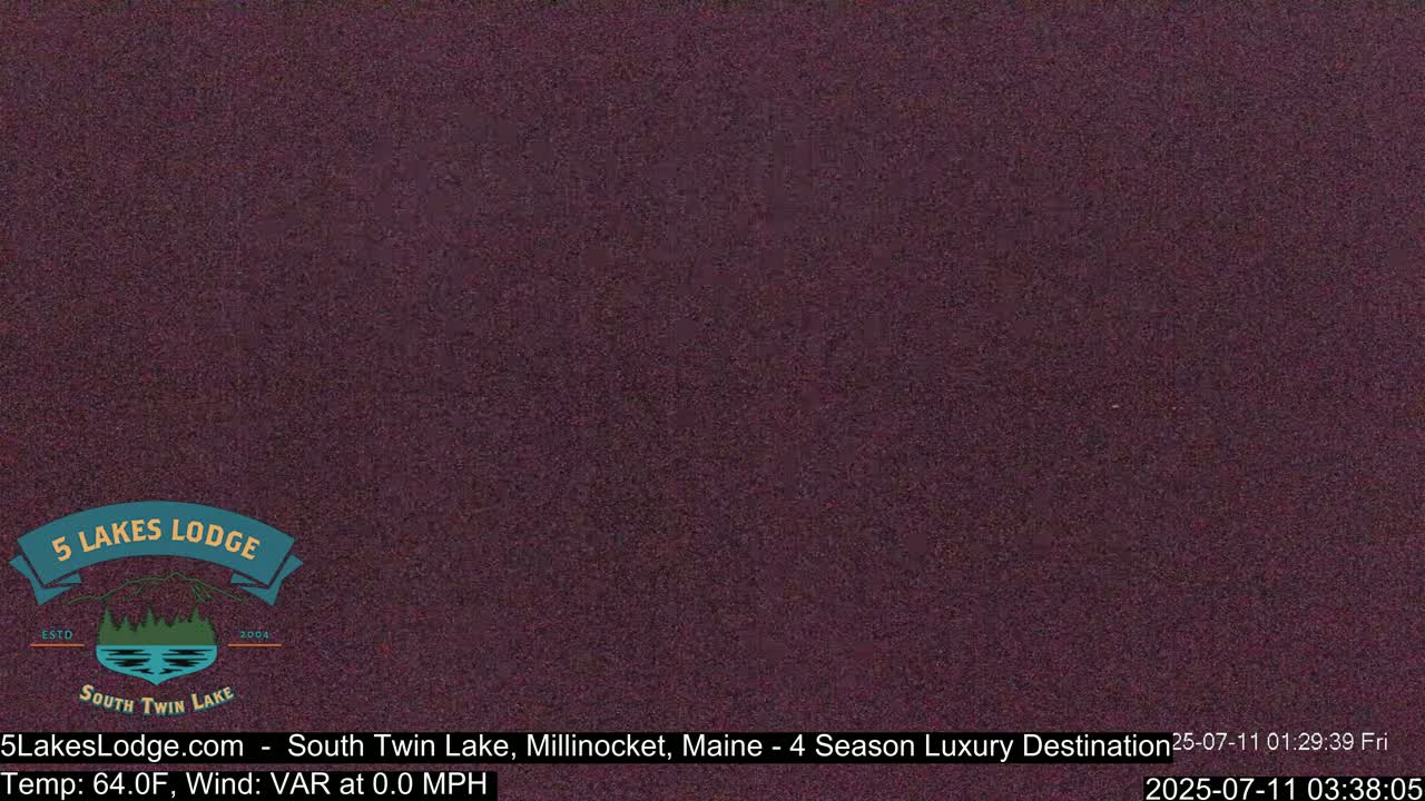 A dark purple screen displays a static image.