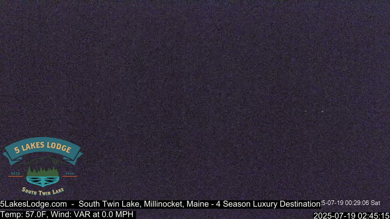 A dark, grainy image shows a static screen.