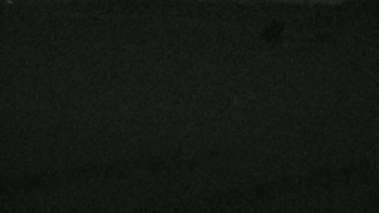 The image shows a dark gray or black textured surface.