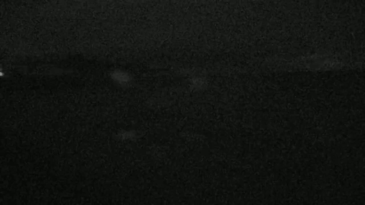 A dark, textured surface is shown, possibly fabric or a similar material.