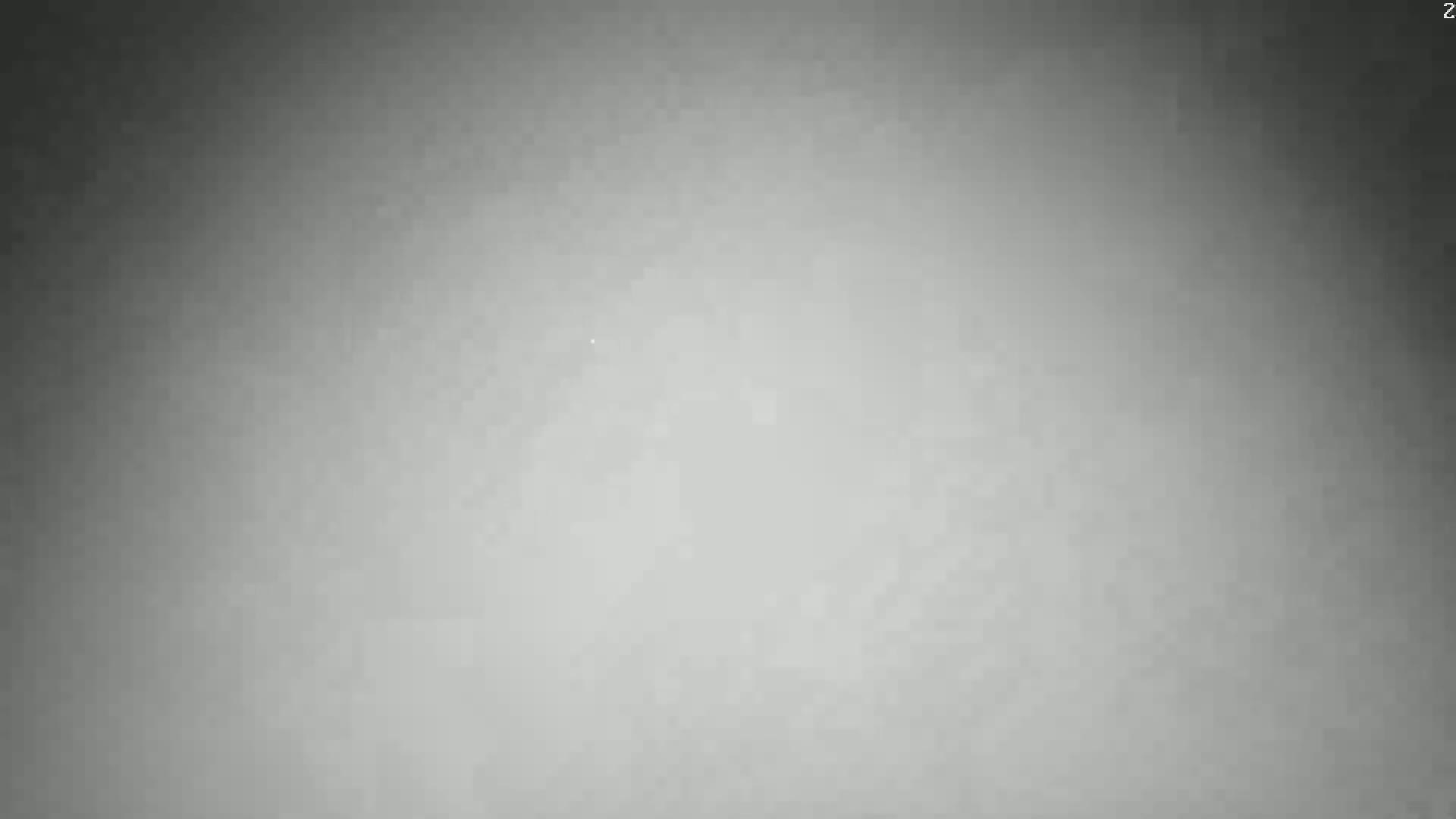 The image shows a uniformly gray, slightly textured surface.