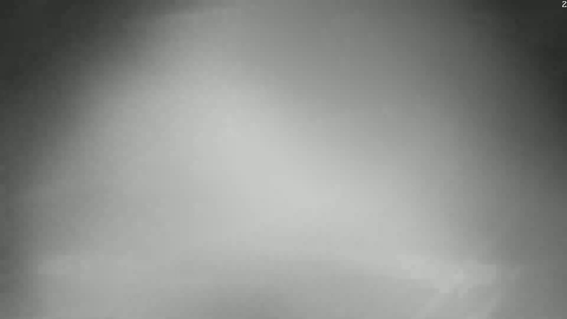 The image shows a hazy, gray expanse.