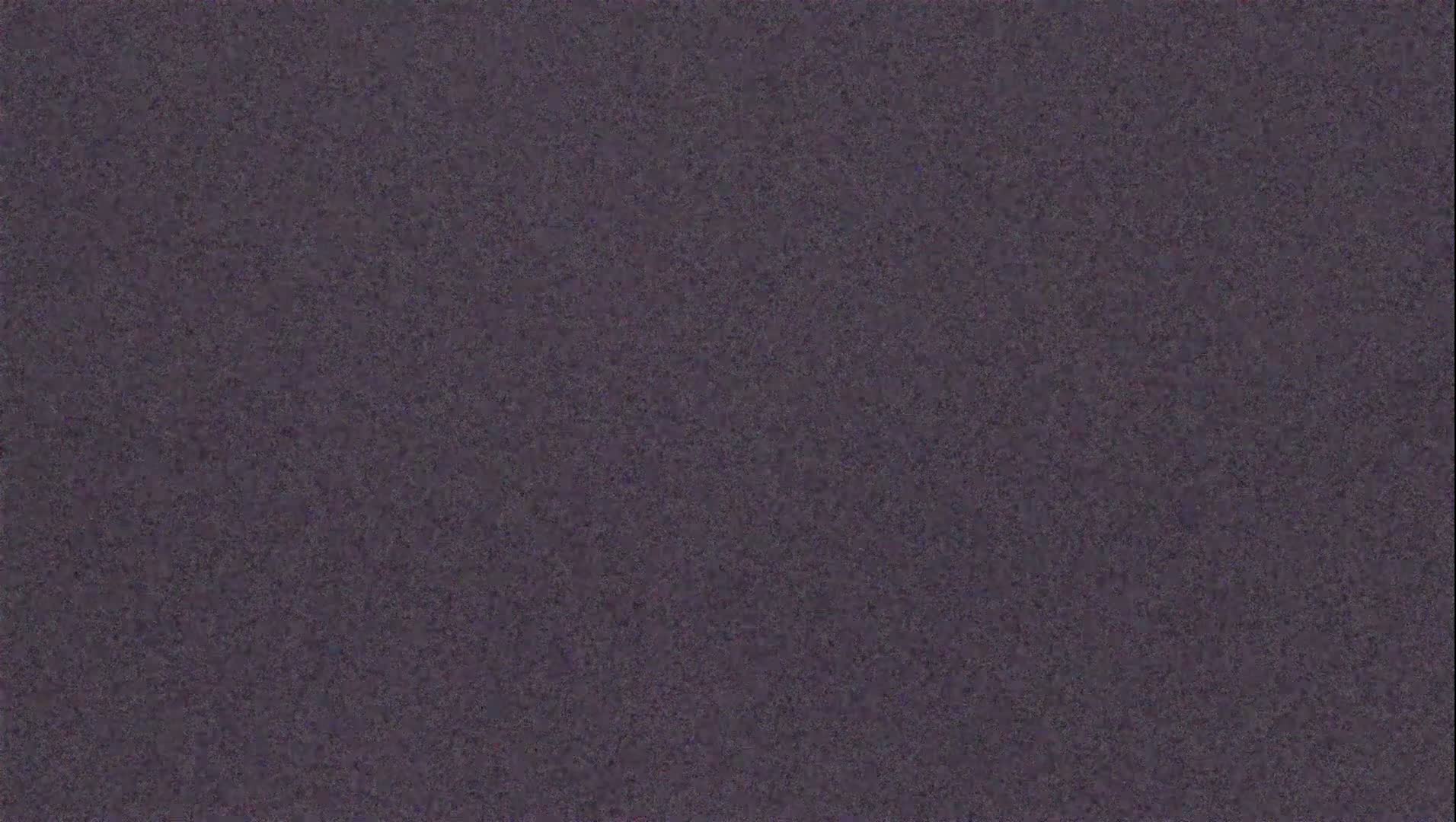 The image shows a uniformly textured dark purplish-gray surface.