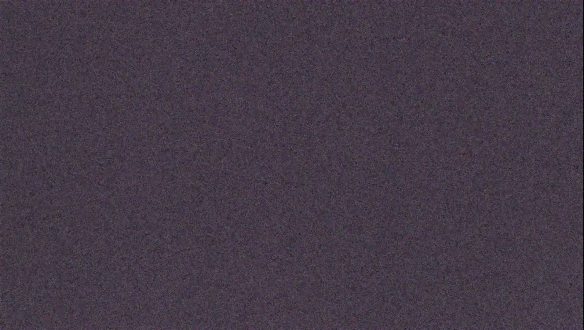 The image shows a dark purplish-gray textured surface.