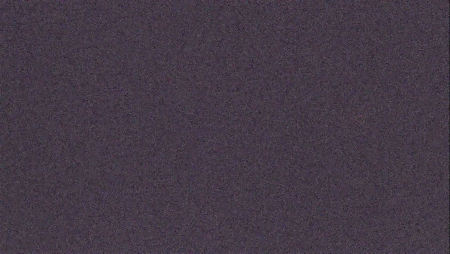 The image shows a uniformly textured, dark purplish-gray surface.