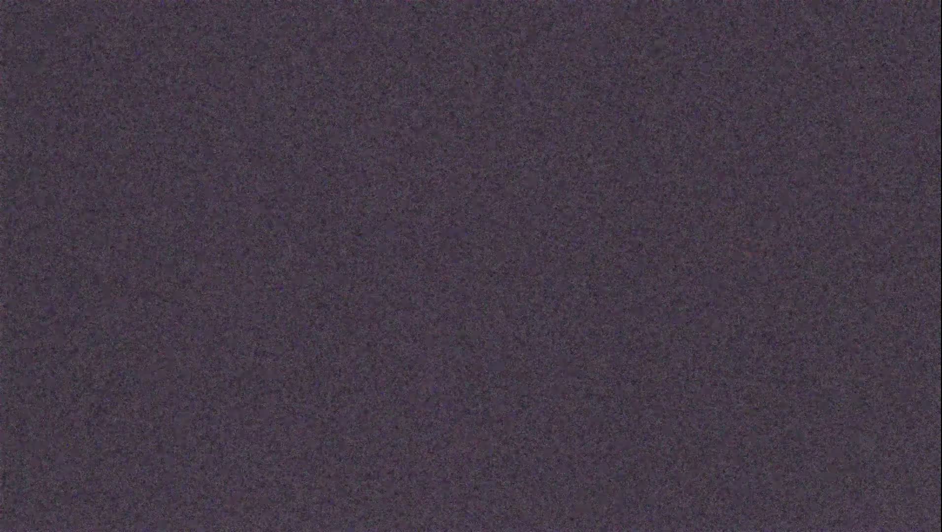 The image shows a dark purplish-gray textured surface.