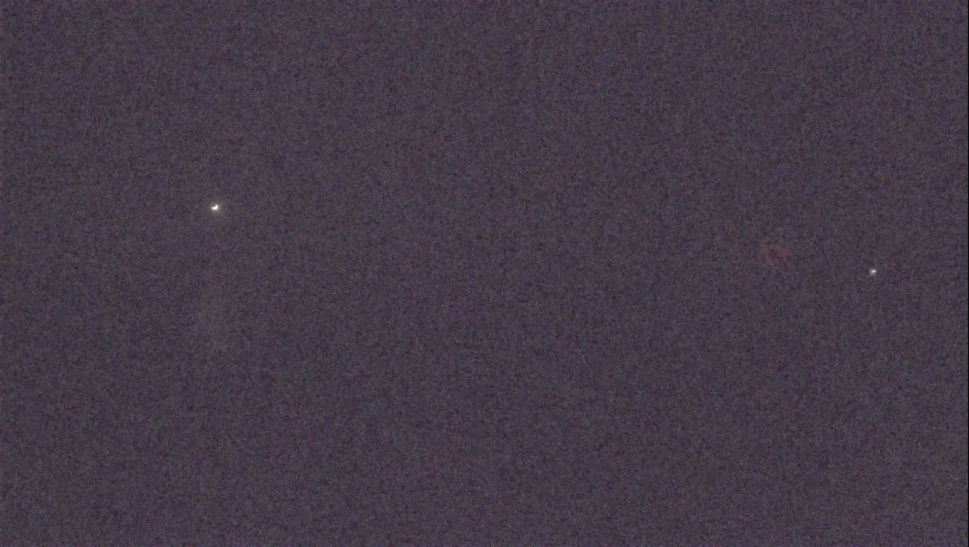 A dark night sky shows three bright celestial objects.