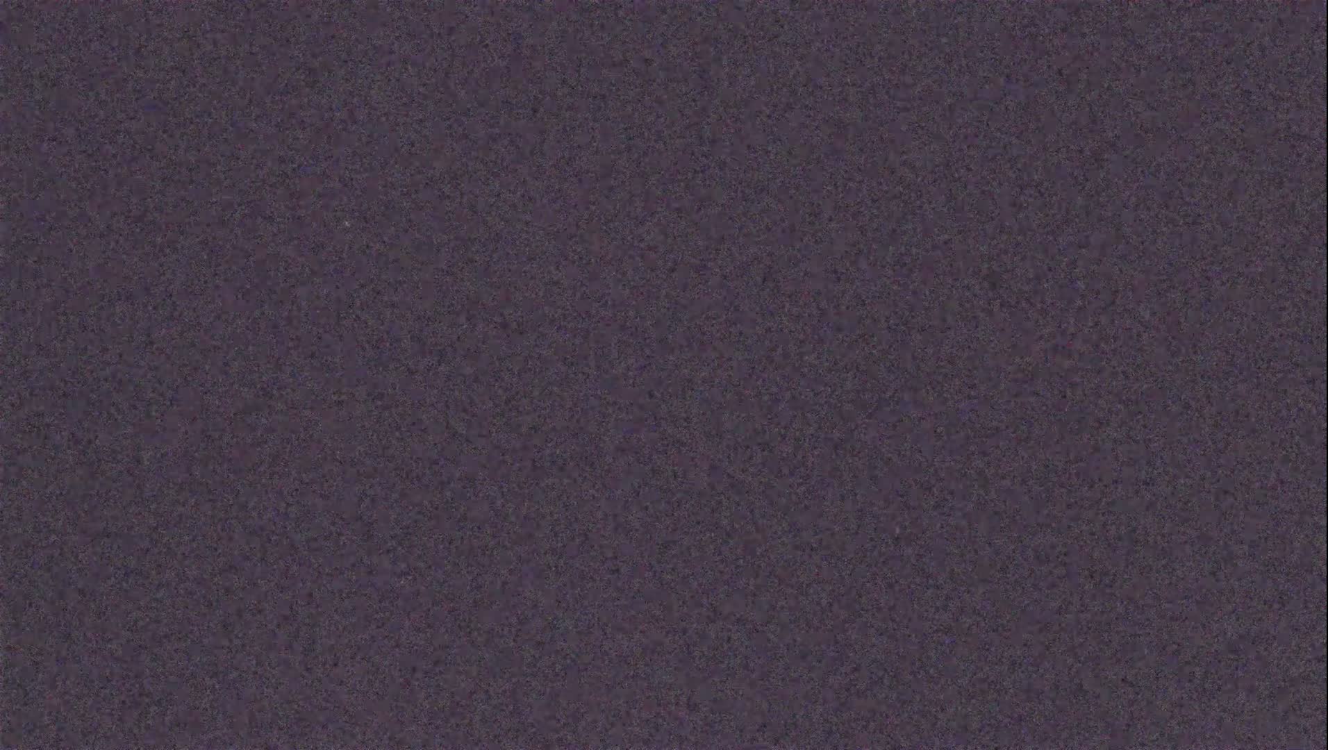 The image shows a dark purple textured surface.