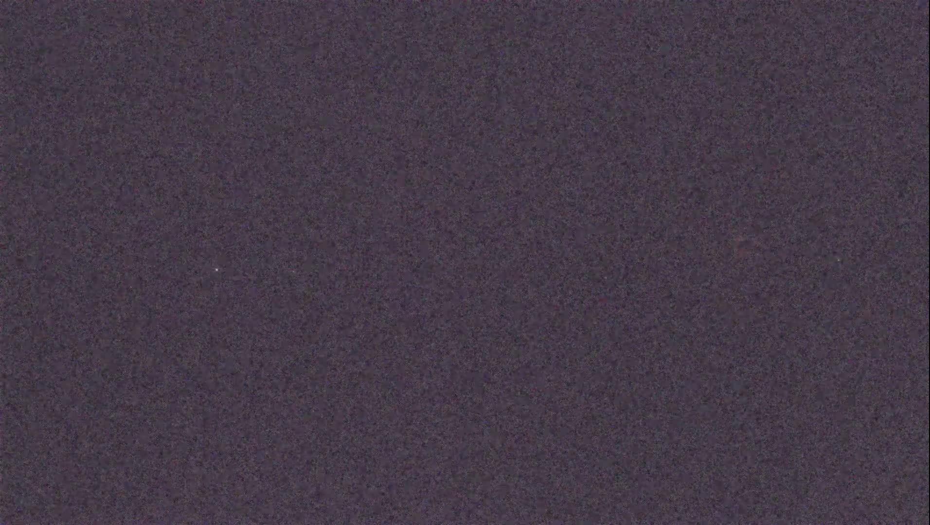 The image shows a dark gray textured surface.