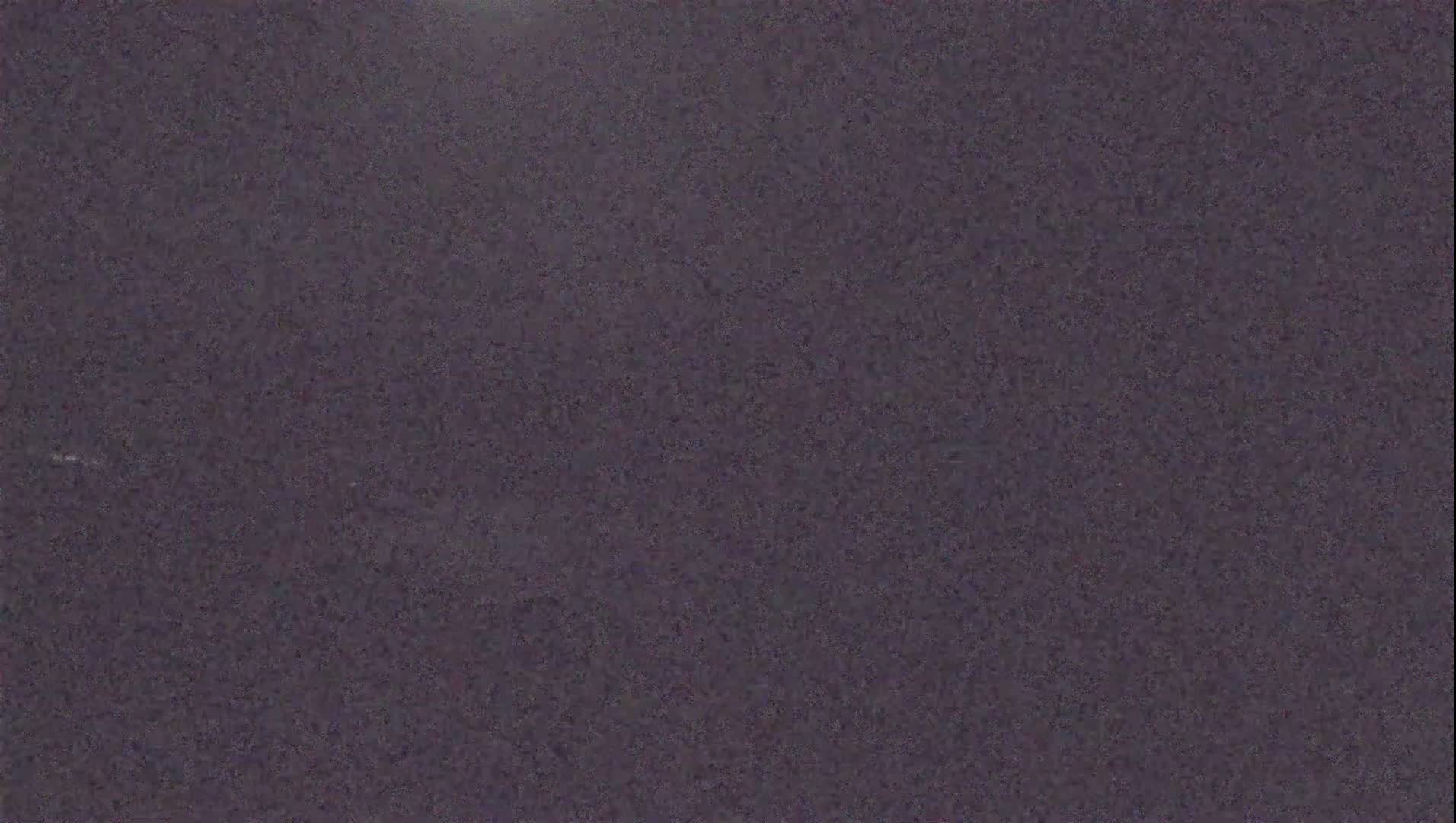 A dark purplish-gray textured surface is shown.
