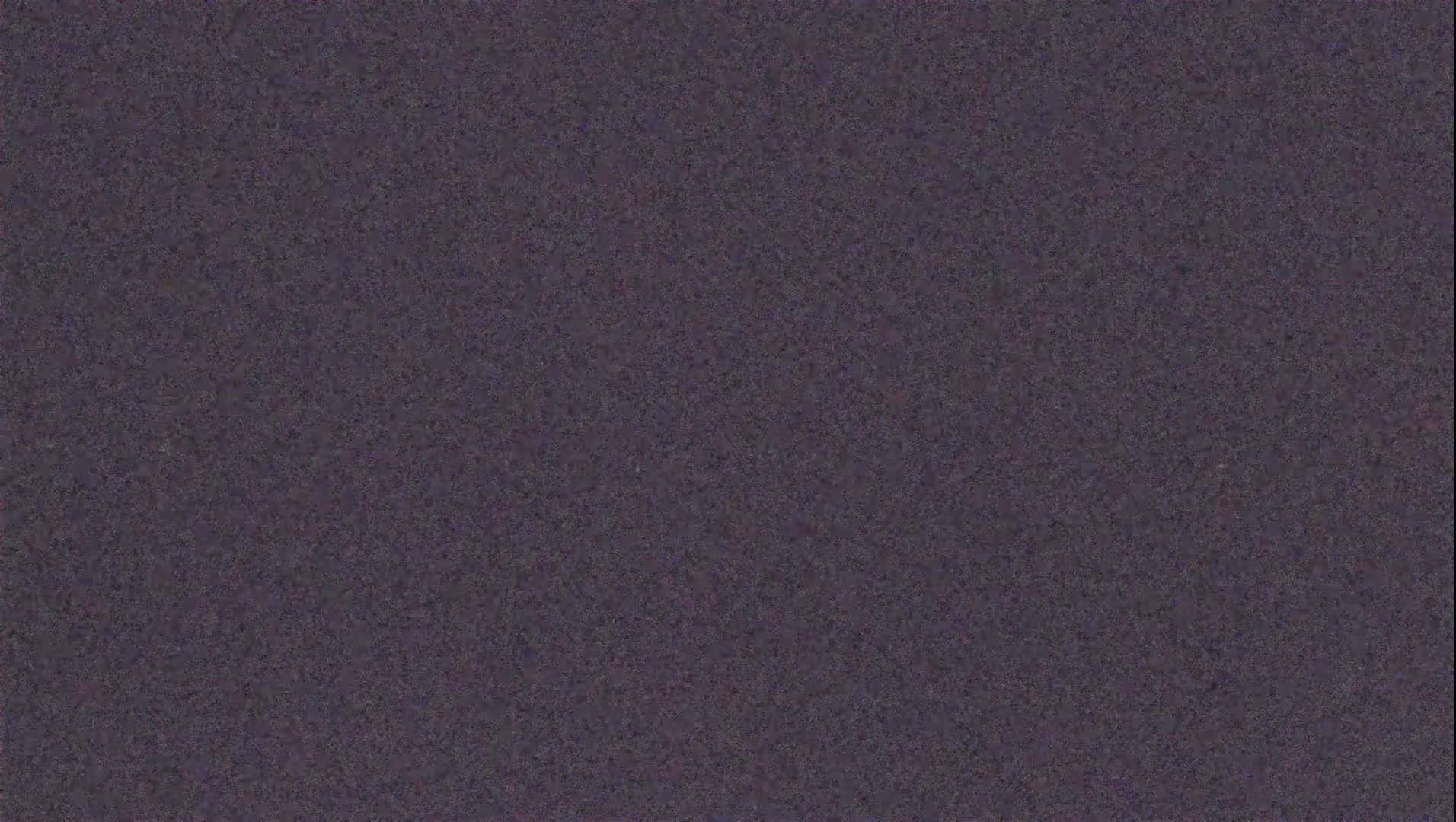 The image shows a uniformly textured dark purplish-gray surface.