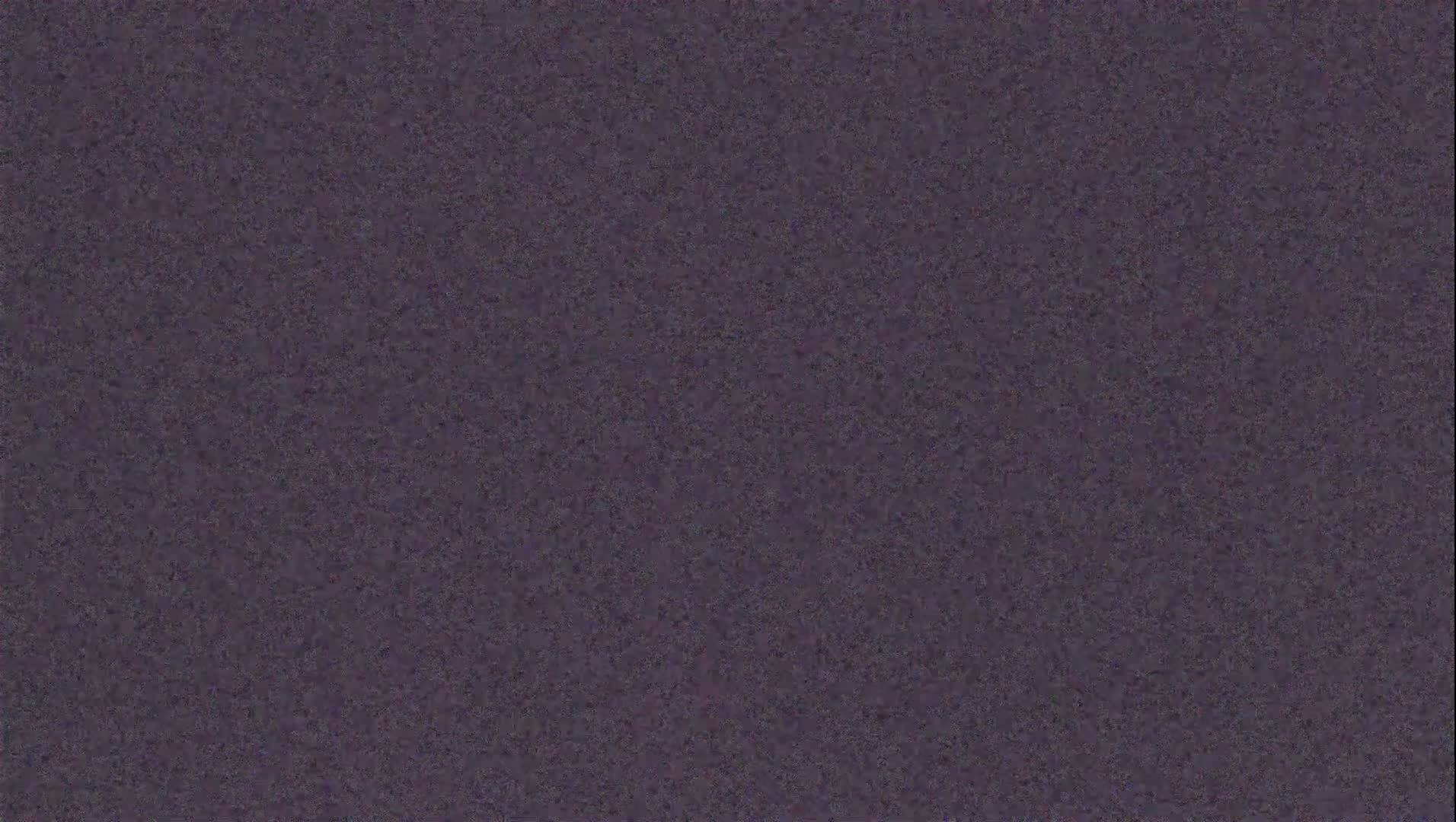 A uniformly textured, dark purplish-gray surface is shown.