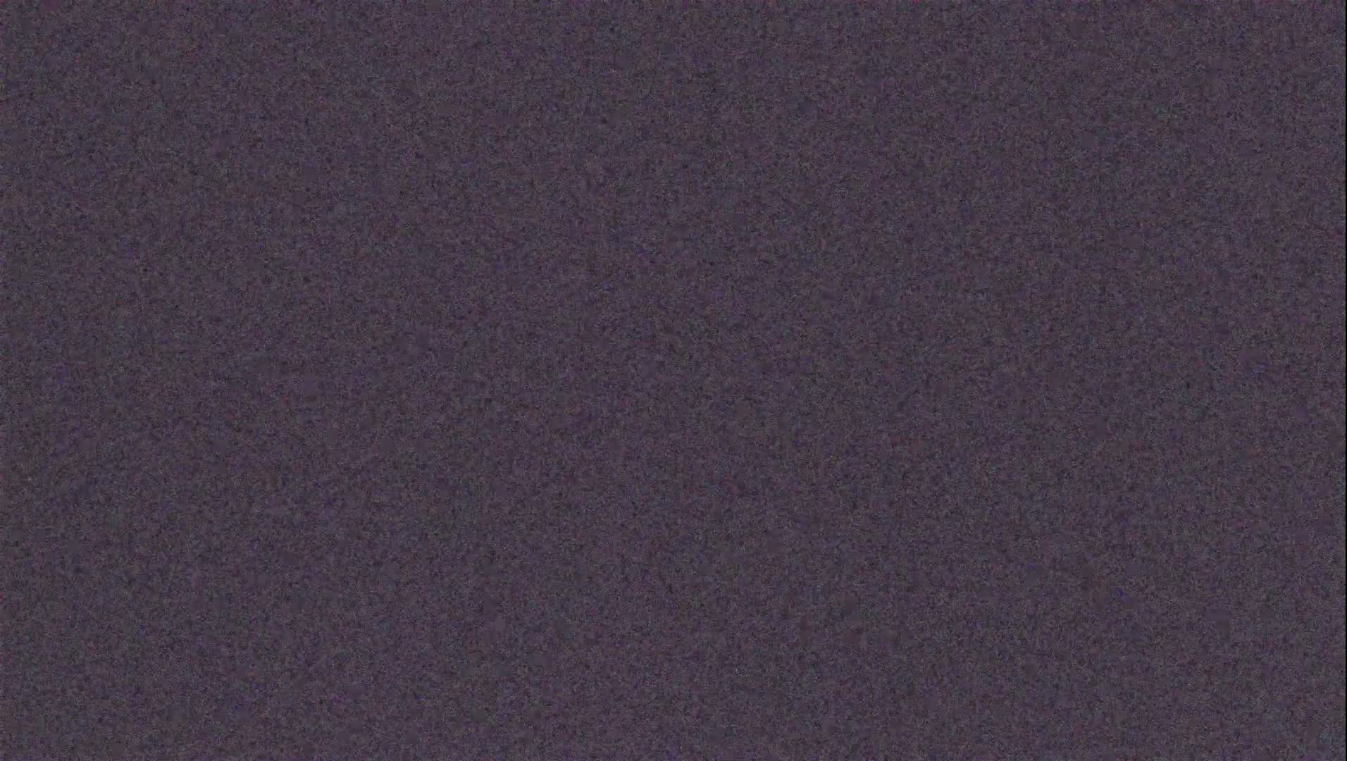 A textured, dark purplish-gray surface is shown.