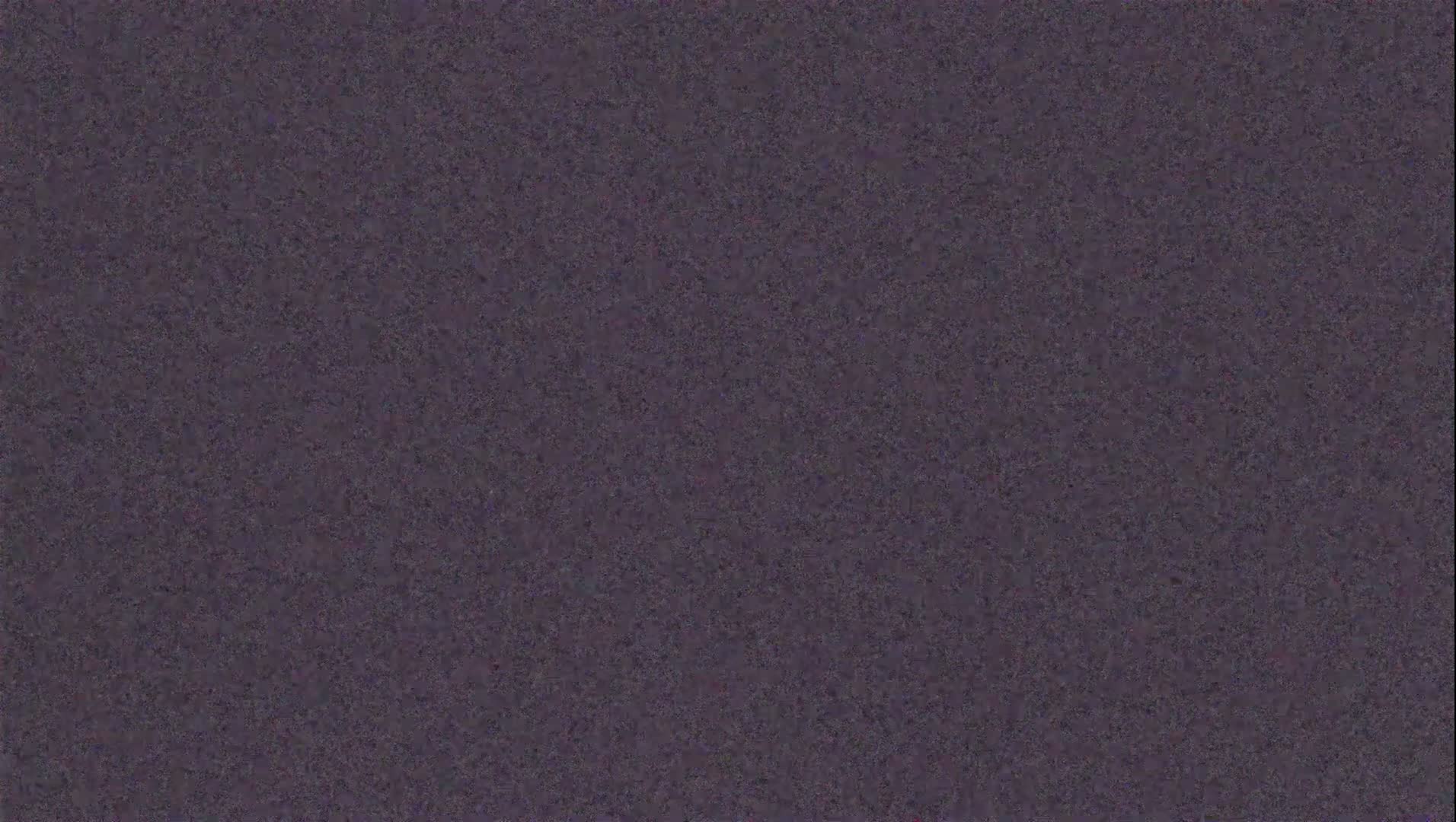 The image shows a dark purplish-gray textured surface.