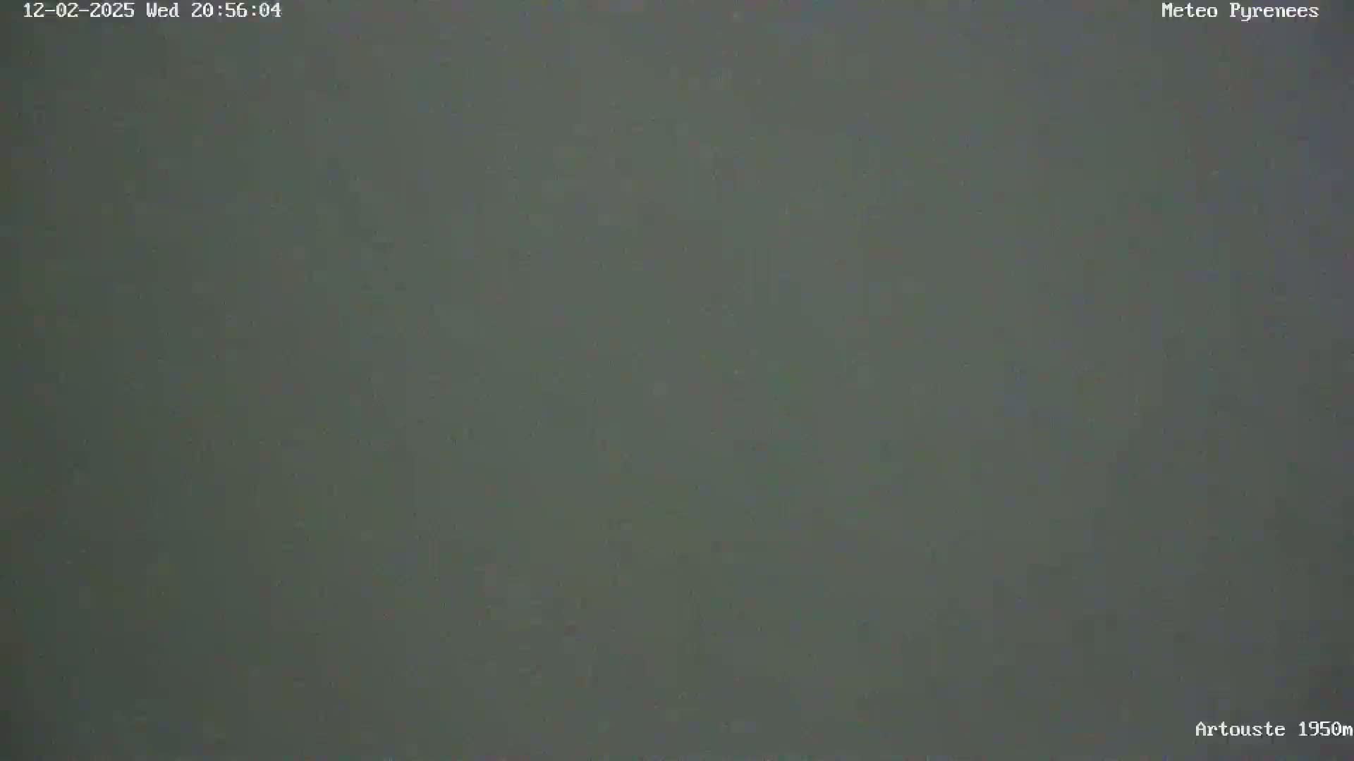 A uniformly dark gray image shows a solid, featureless expanse under overcast conditions.