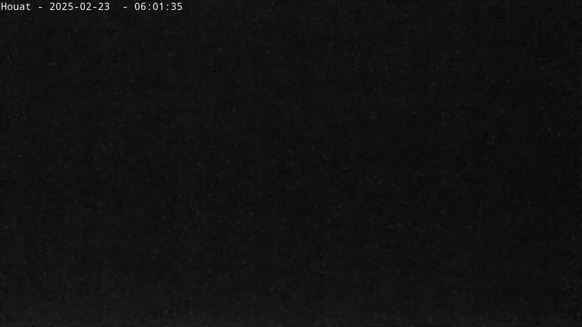 The image shows a uniformly dark gray or black surface.