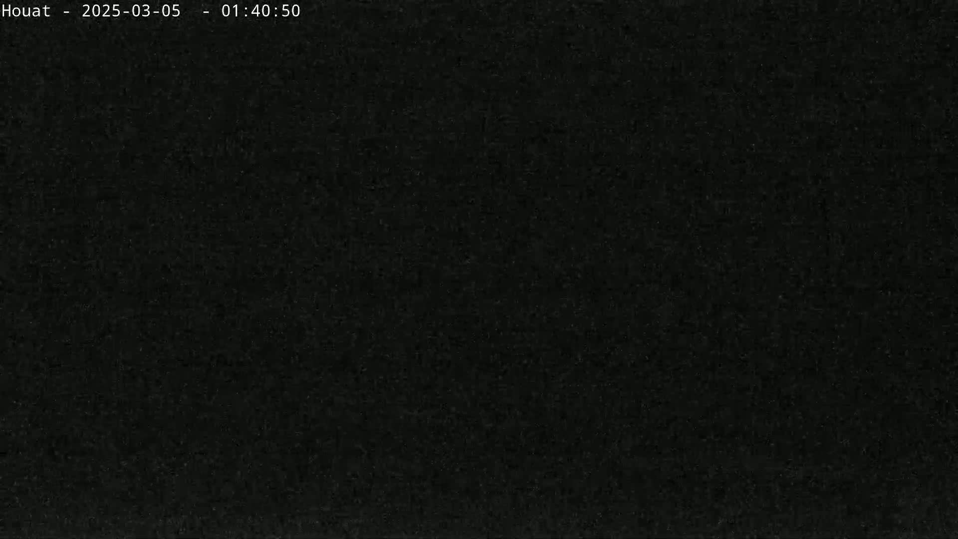 The image shows a completely dark, grainy, and uniform black screen.