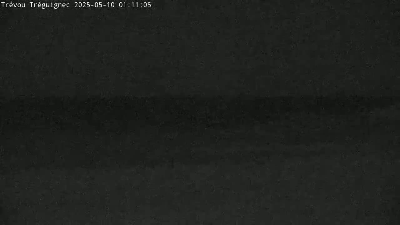 A dark, grainy image shows a mostly uniform black expanse.
