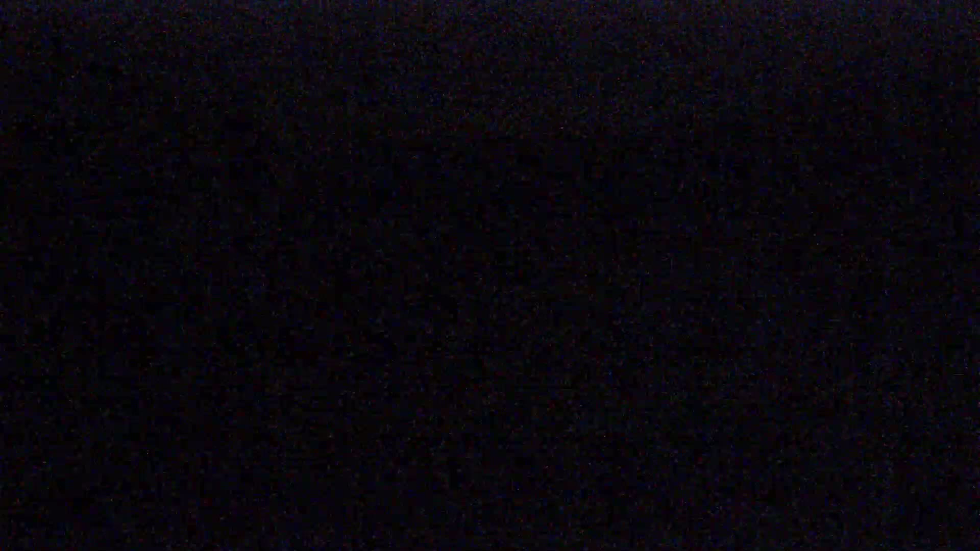 The image is a completely black screen with slight graininess.