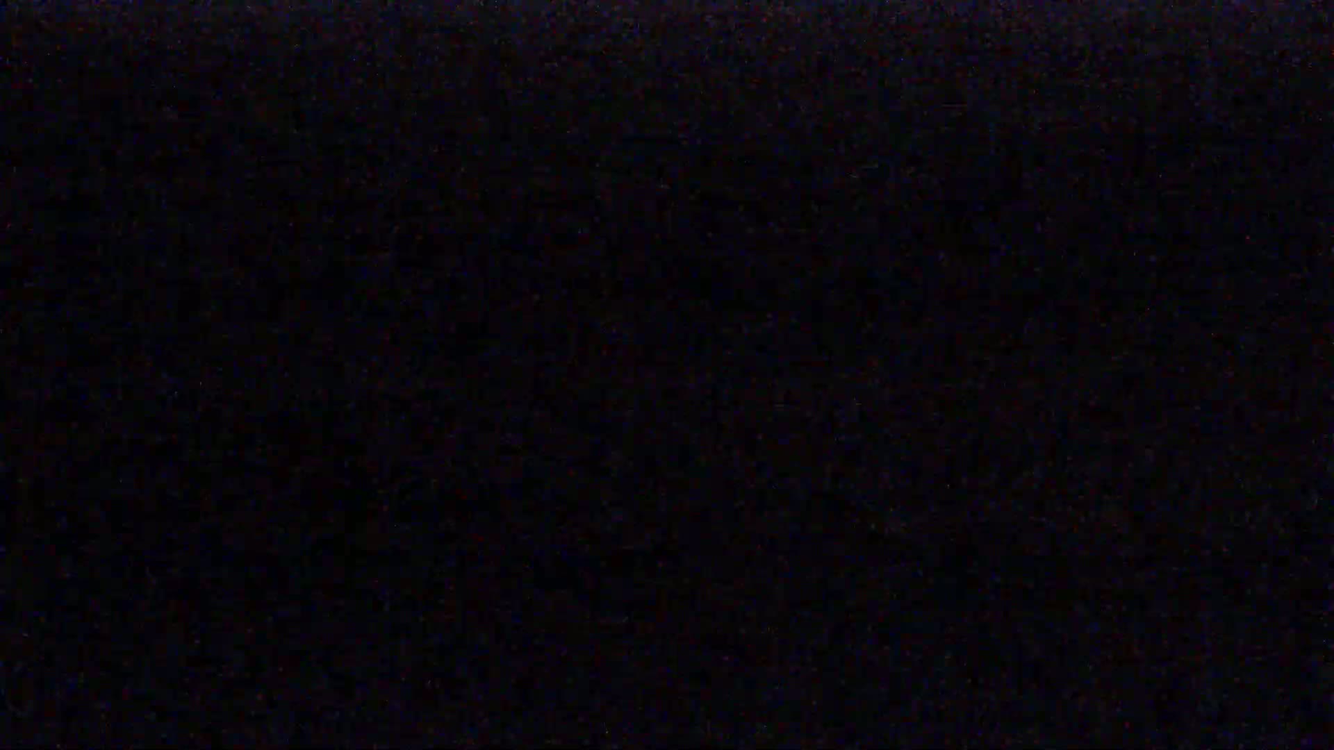 The image is a completely black screen with subtle variations in shading.