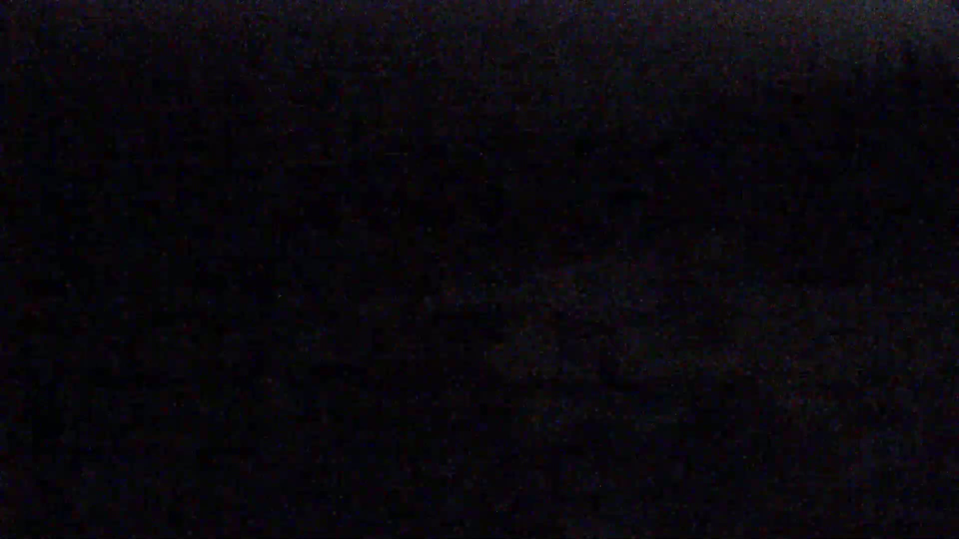 The image is an almost entirely black screen with slight variations in shade and texture.