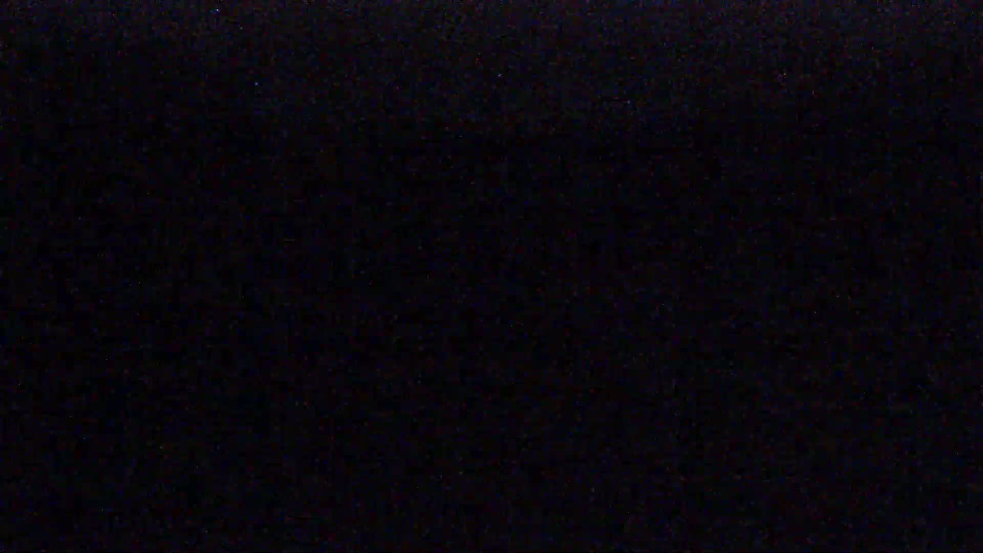 The image is a solid black screen with subtle variations in shading.