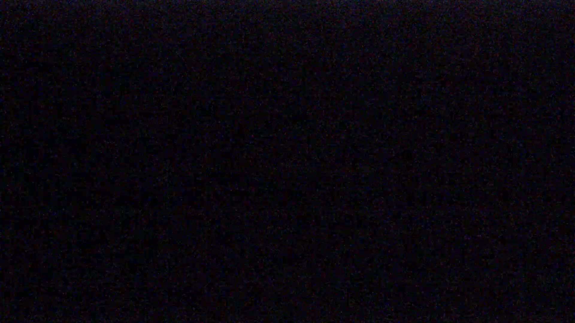 The image shows a uniformly dark, almost black background with slight variations in shading.