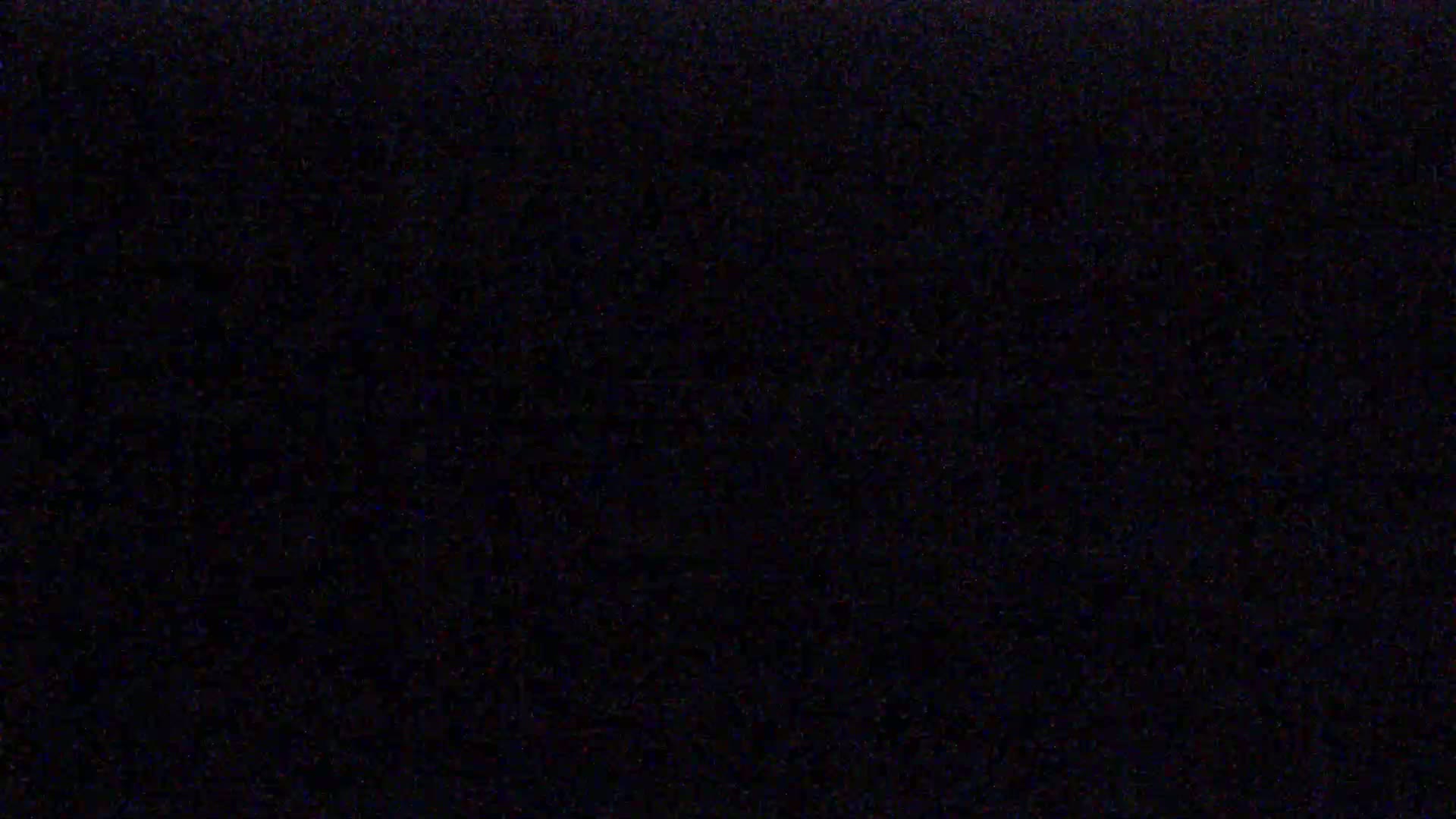 The image is a solid, dark-colored field with subtle variations in shading.