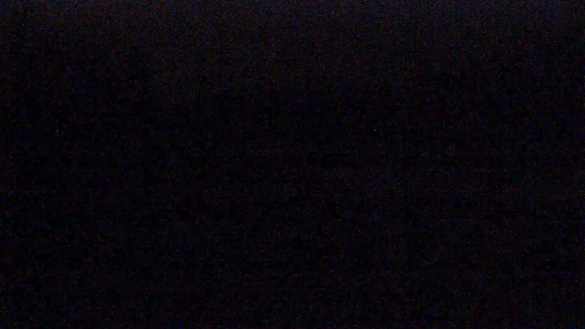 The image is entirely black with a slightly grainy texture.