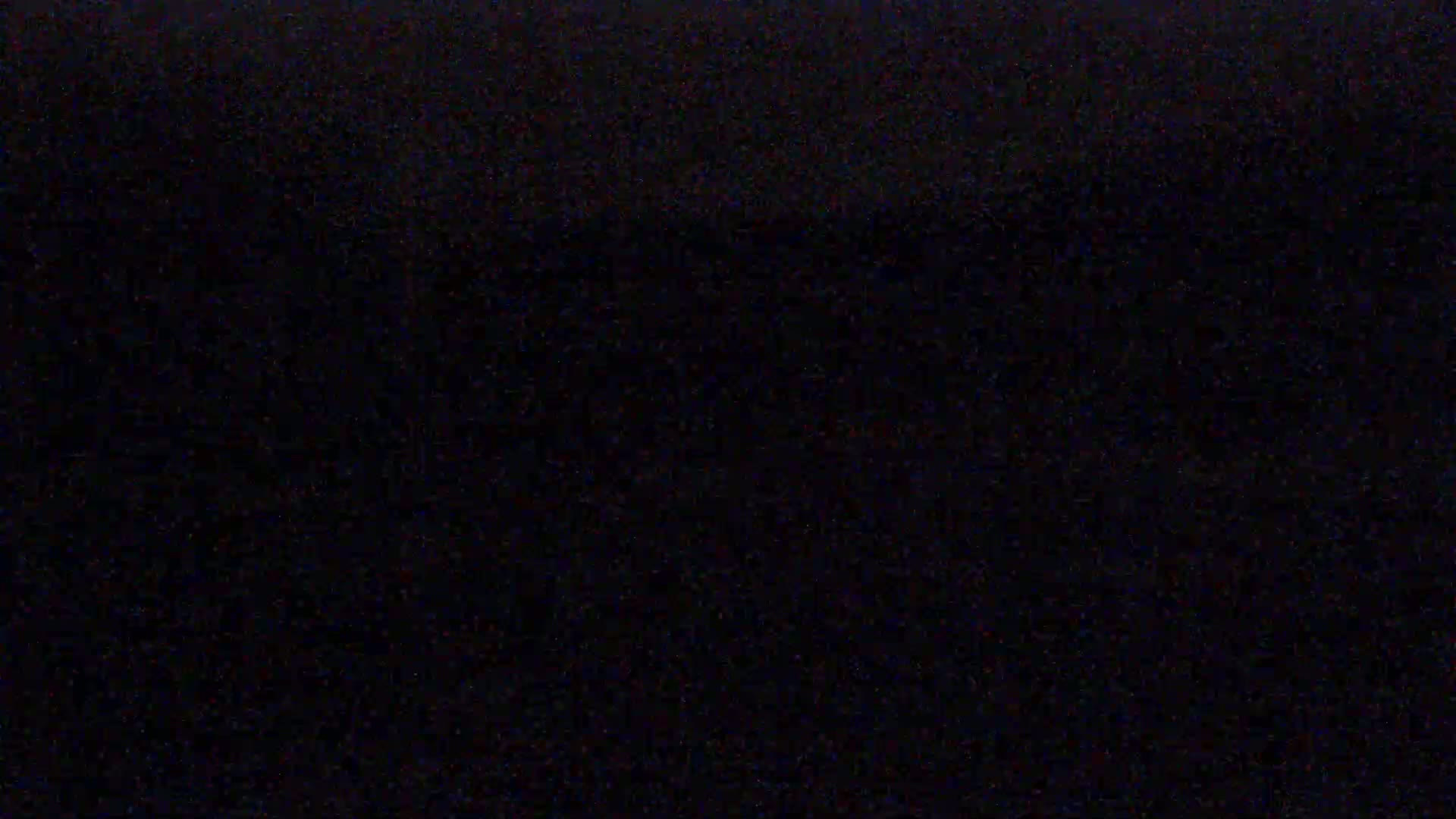 The image is a completely black, grainy screen.