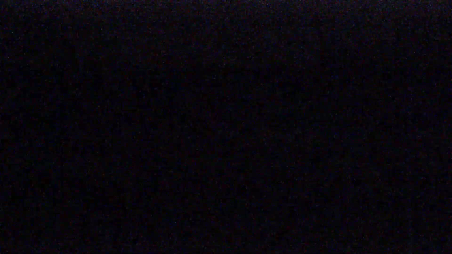 The image is a completely black screen with slight variations in shading.