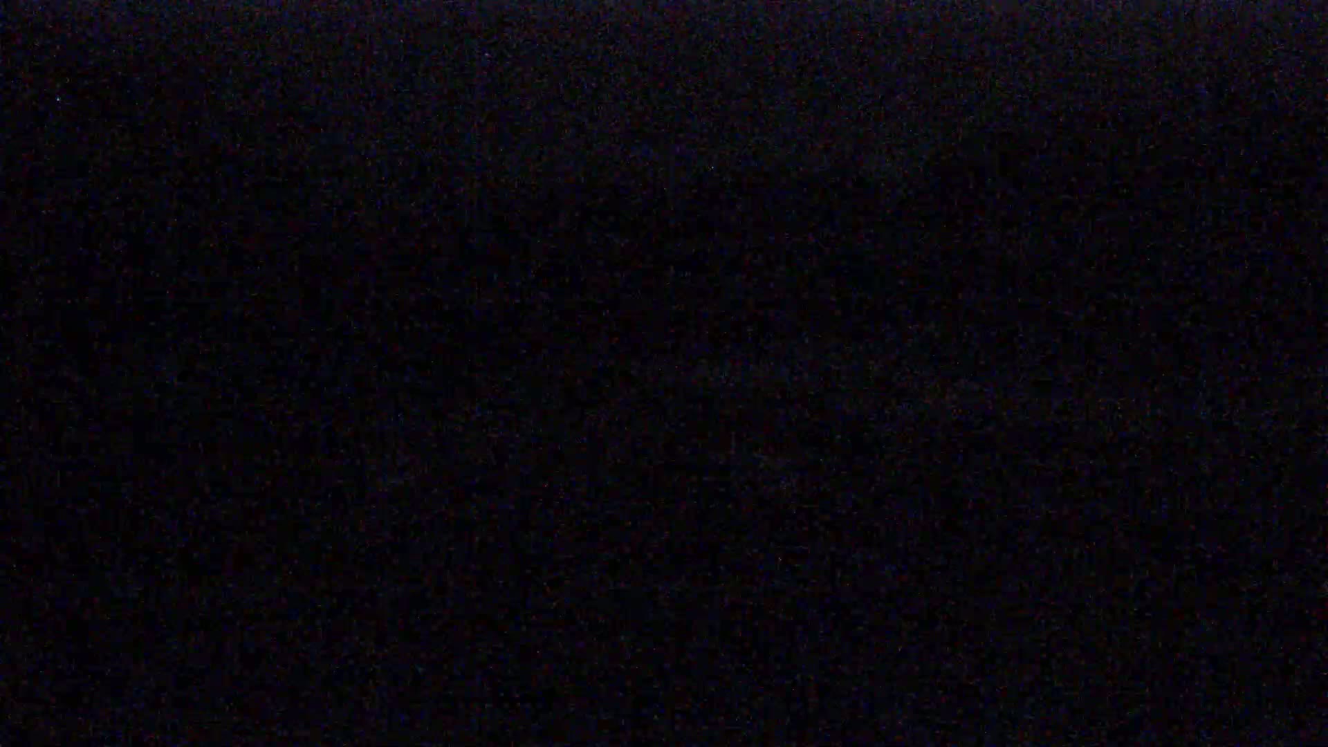 The image is a completely black screen with slight variations in shade.