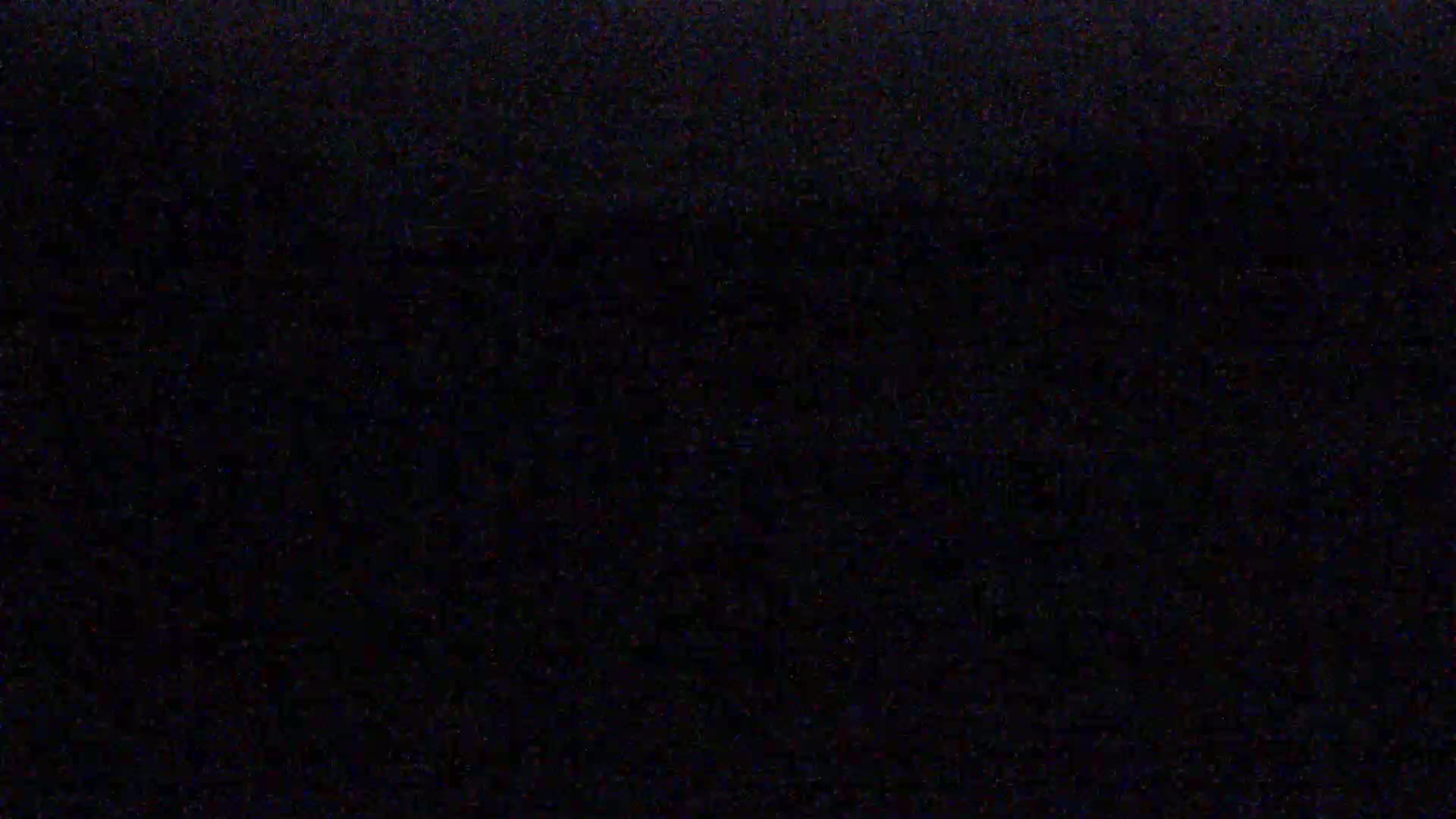 The image shows a completely black field with slight variations in shading.