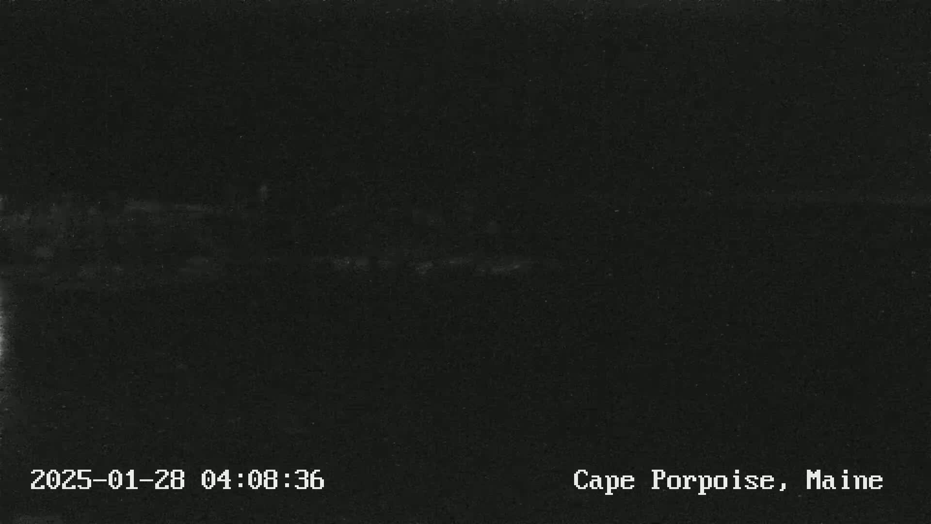 A very dark image shows an indistinguishable scene at night.