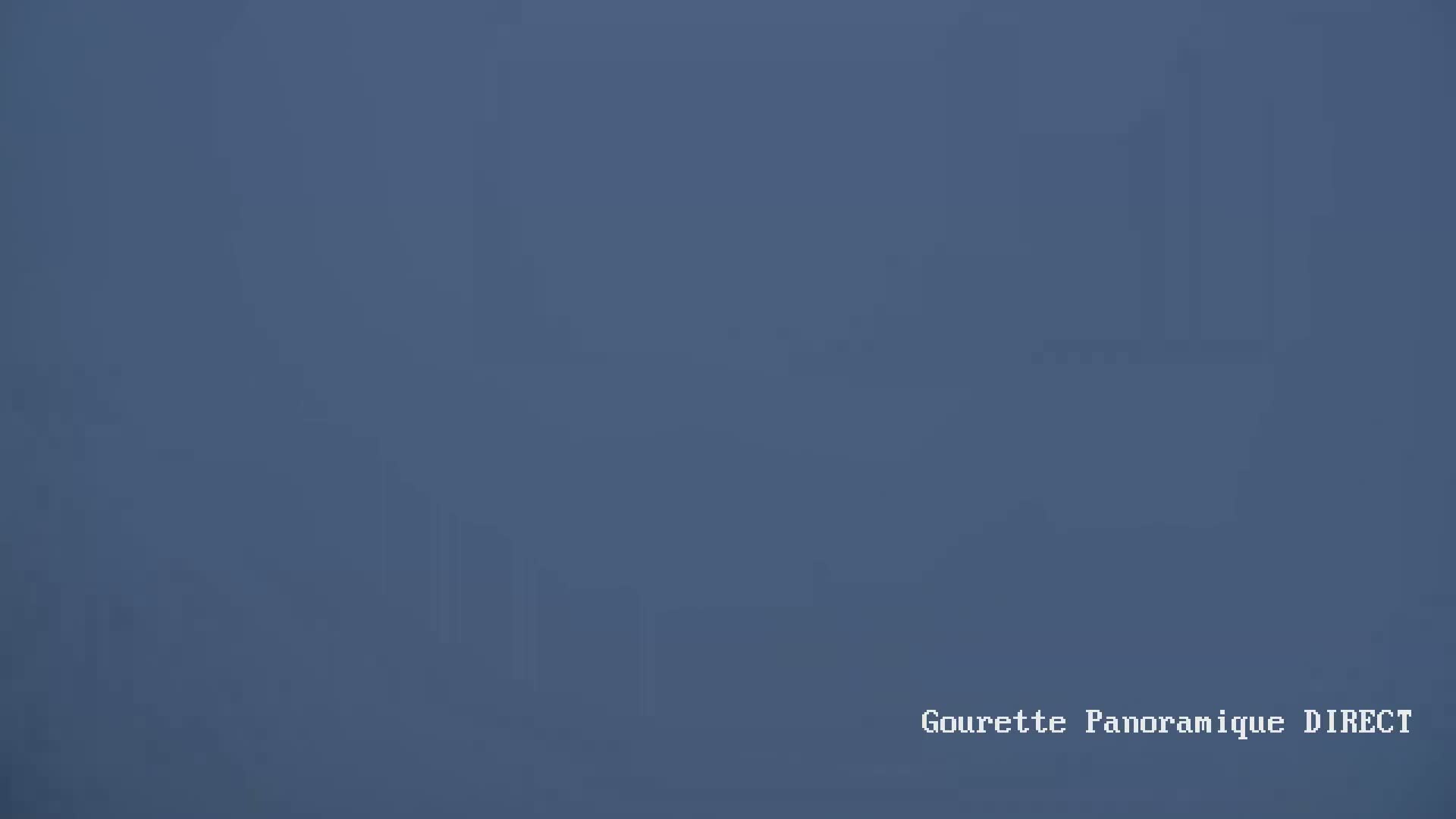 A hazy, dark blue sky fills the entire image.