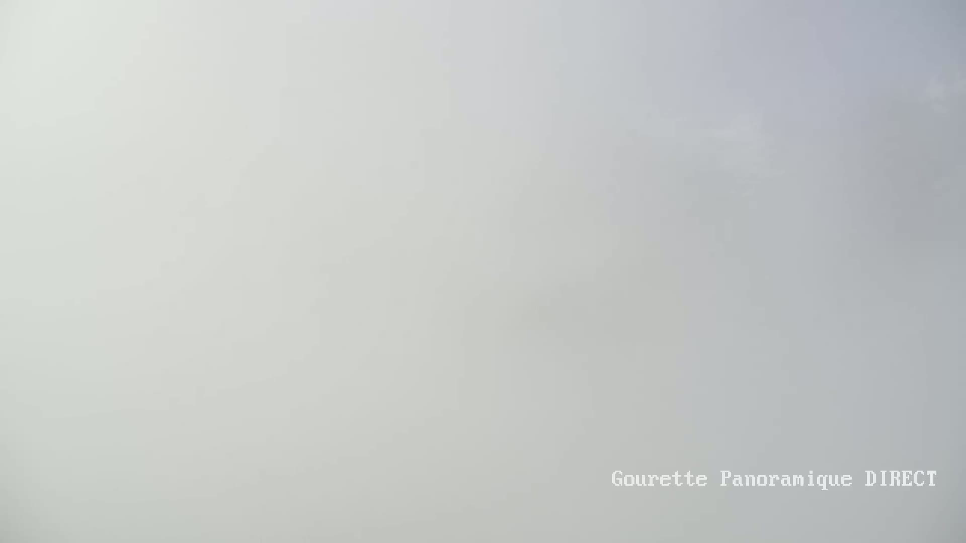 A mostly overcast sky is visible, with a light grey hue dominating the view.
