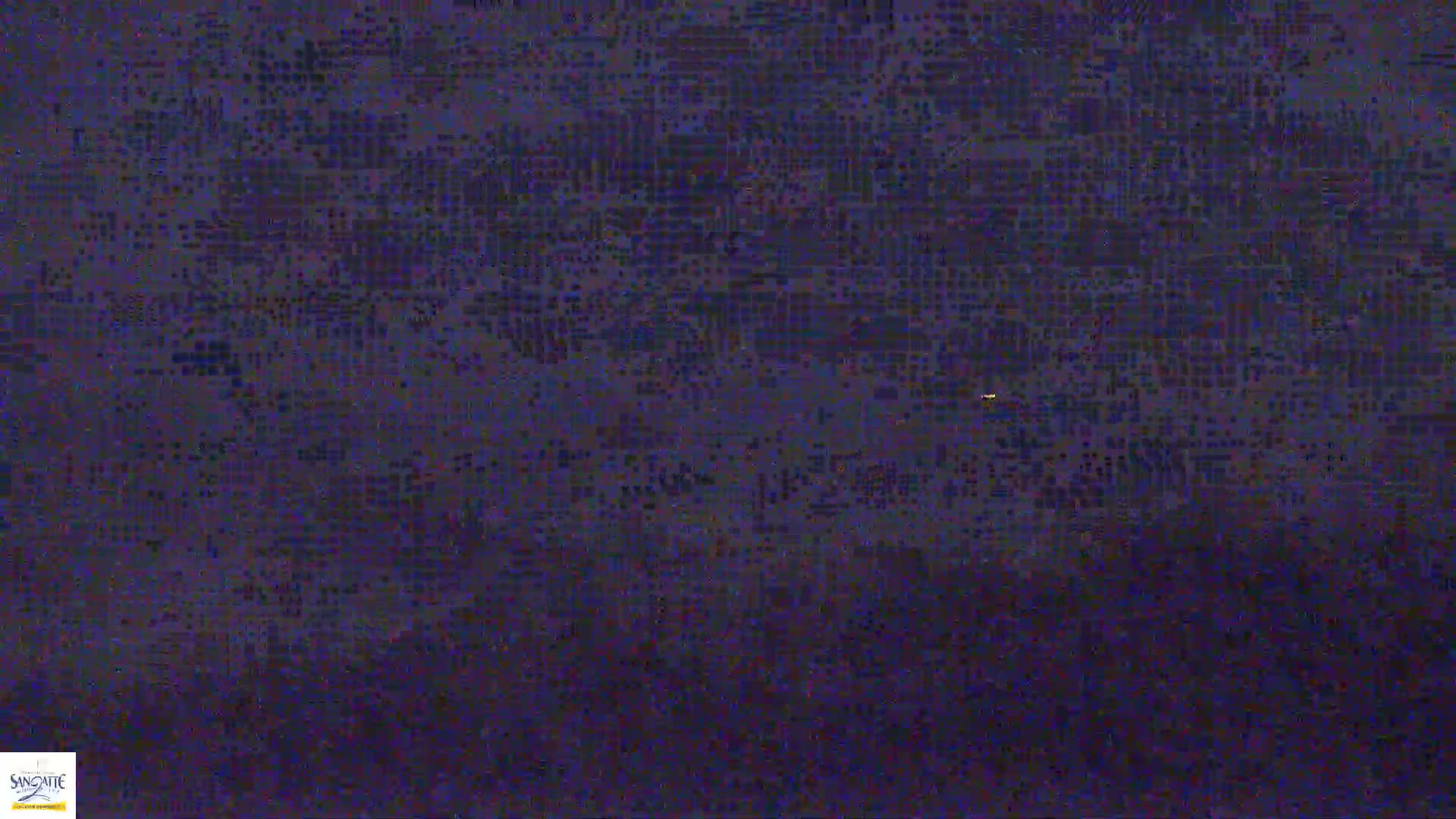 A heavily pixelated image shows a dark, possibly nighttime scene.