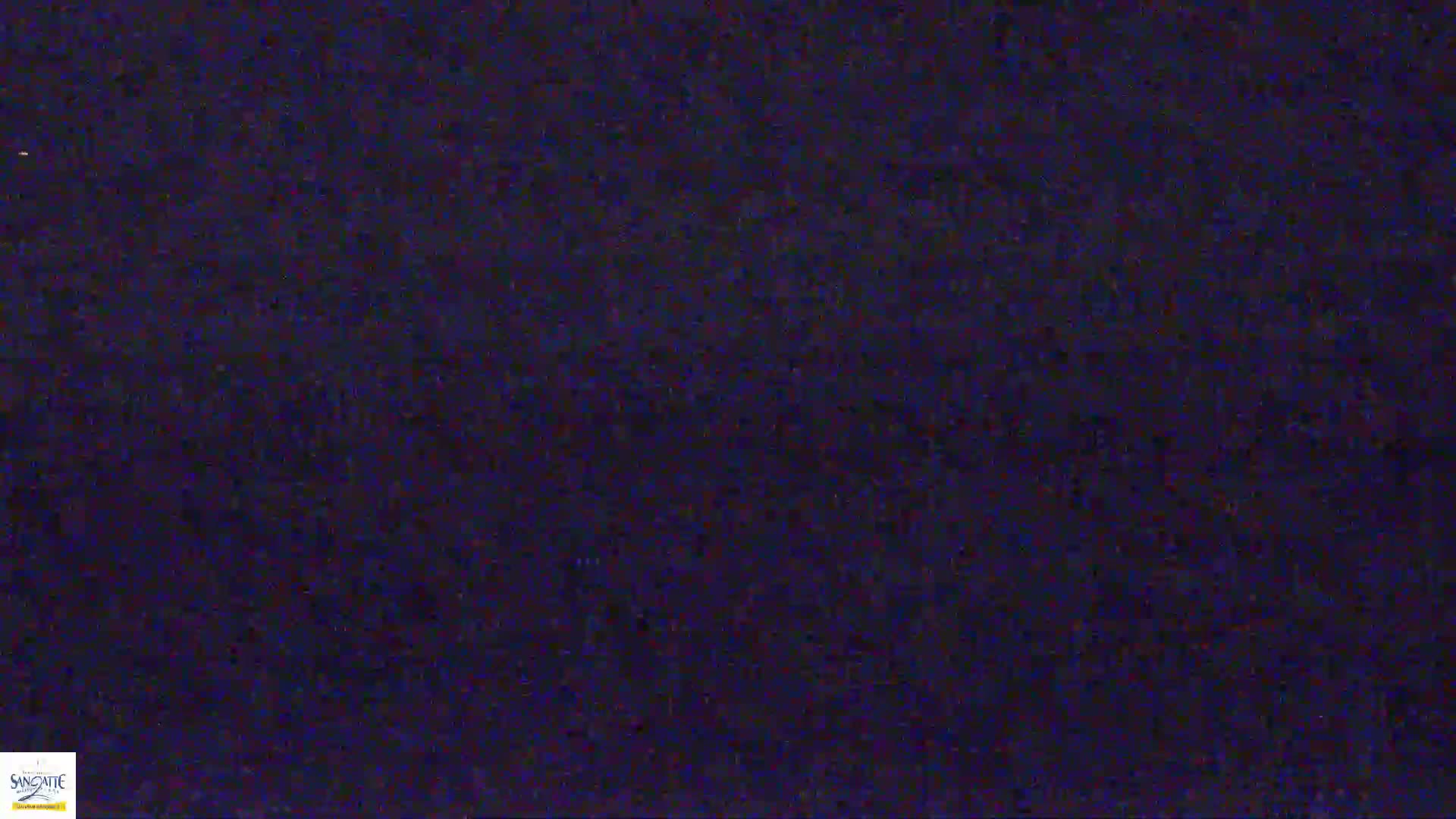 A dark, grainy image fills the frame.