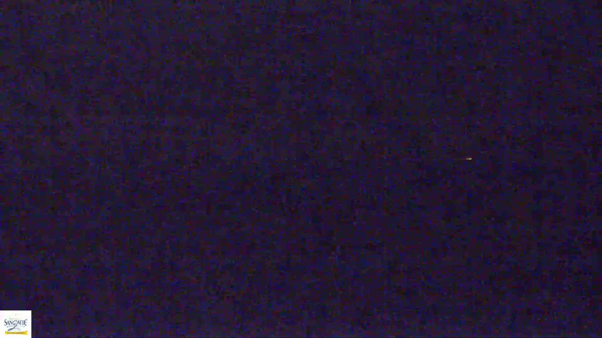 A very dark blue, possibly nighttime, sky shows a single, small, distant light.