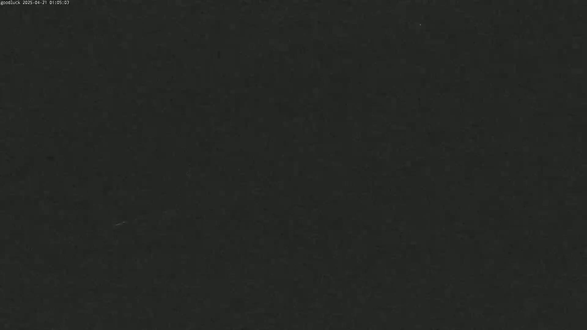 The image shows a uniformly dark gray or black surface.