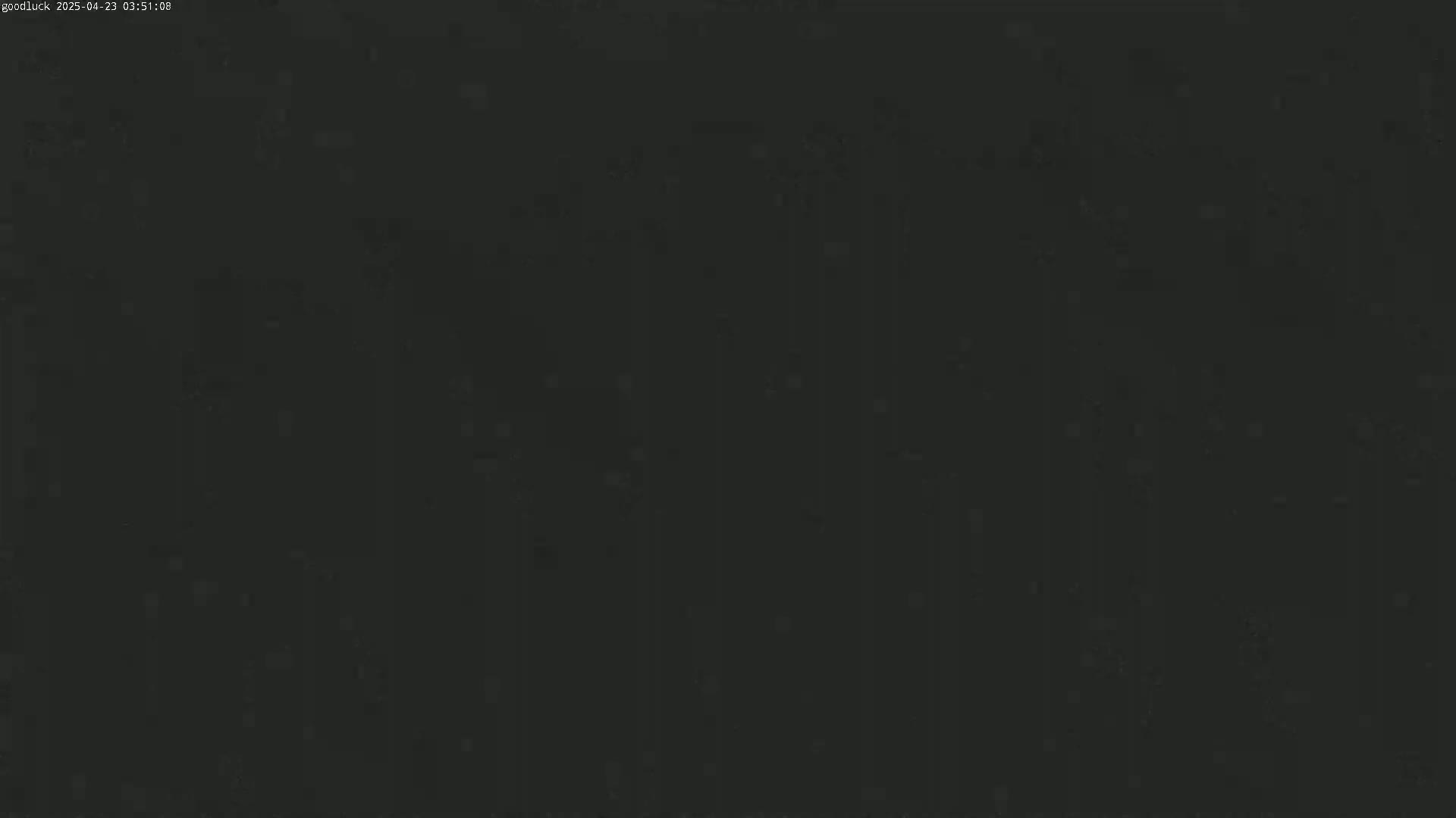 A dark, blurry image shows an indiscernible scene at night.