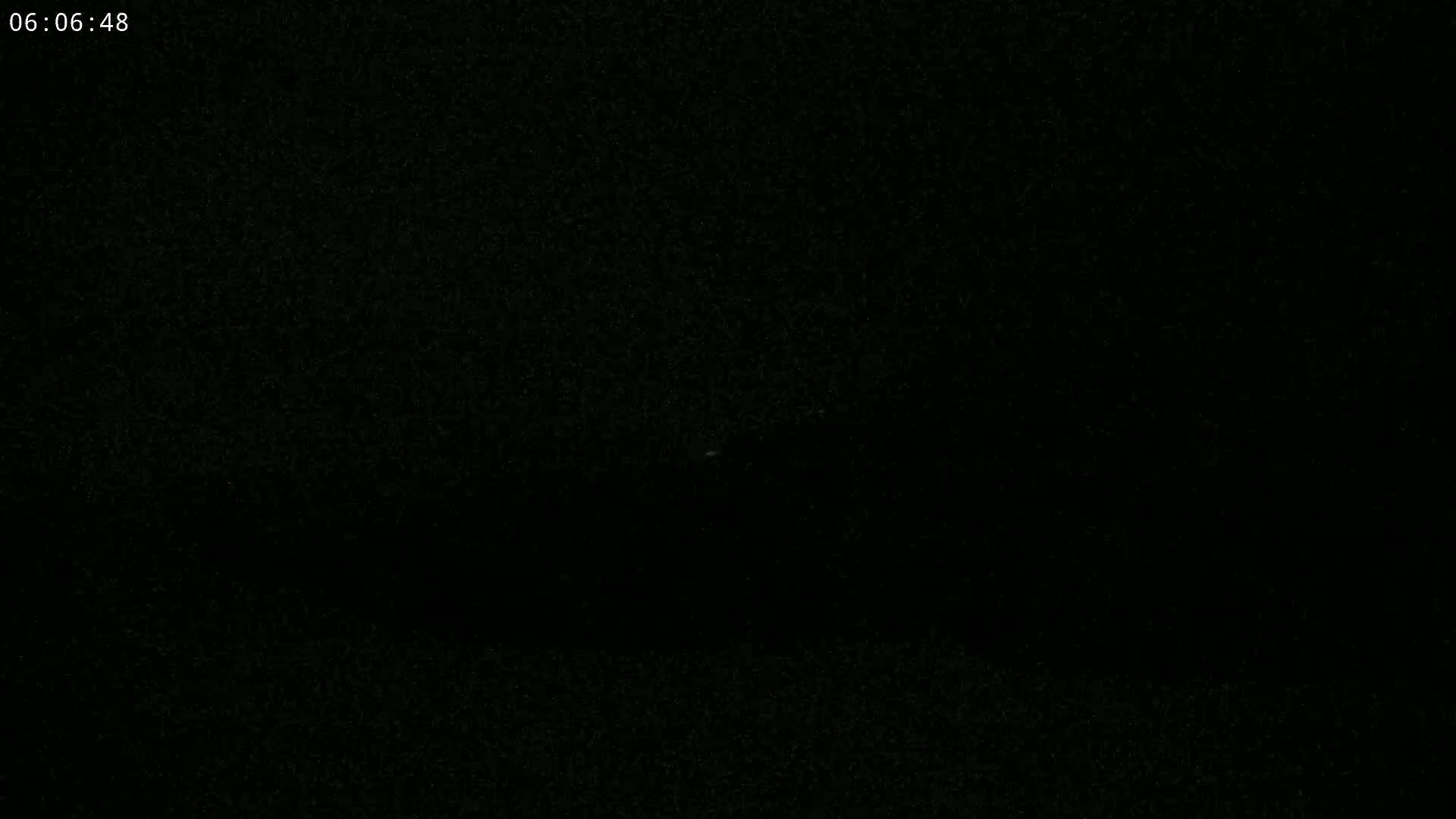 The image is completely black with a slightly grainy texture.