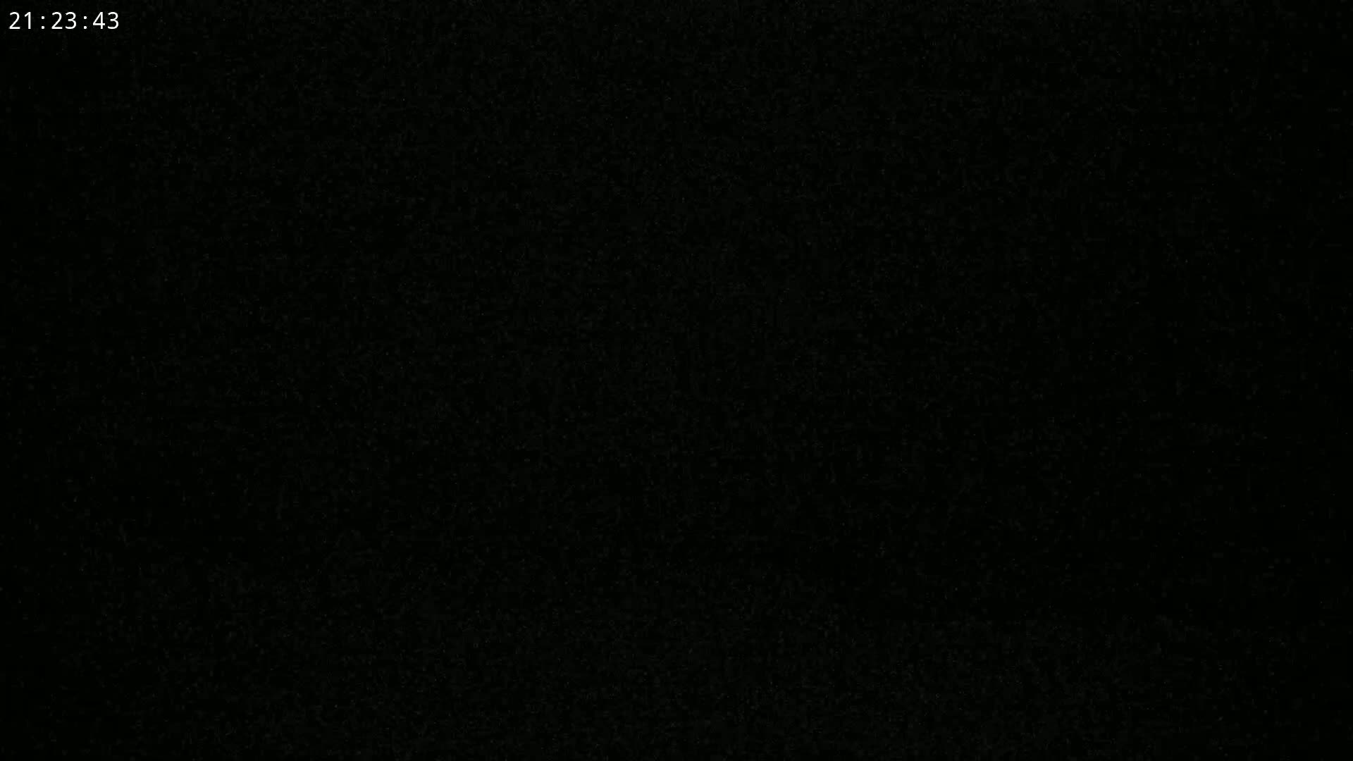 The image is a completely black screen with a slightly grainy texture.